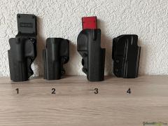 Diverse Holster und Magazine